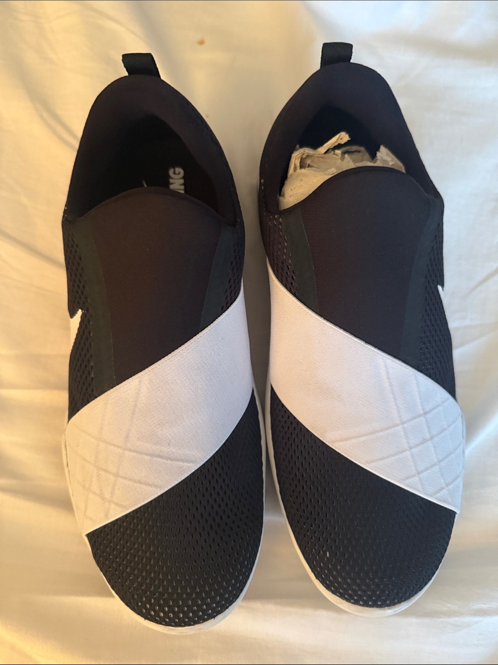 Nike Women's Black and White Slip-On Sneakers